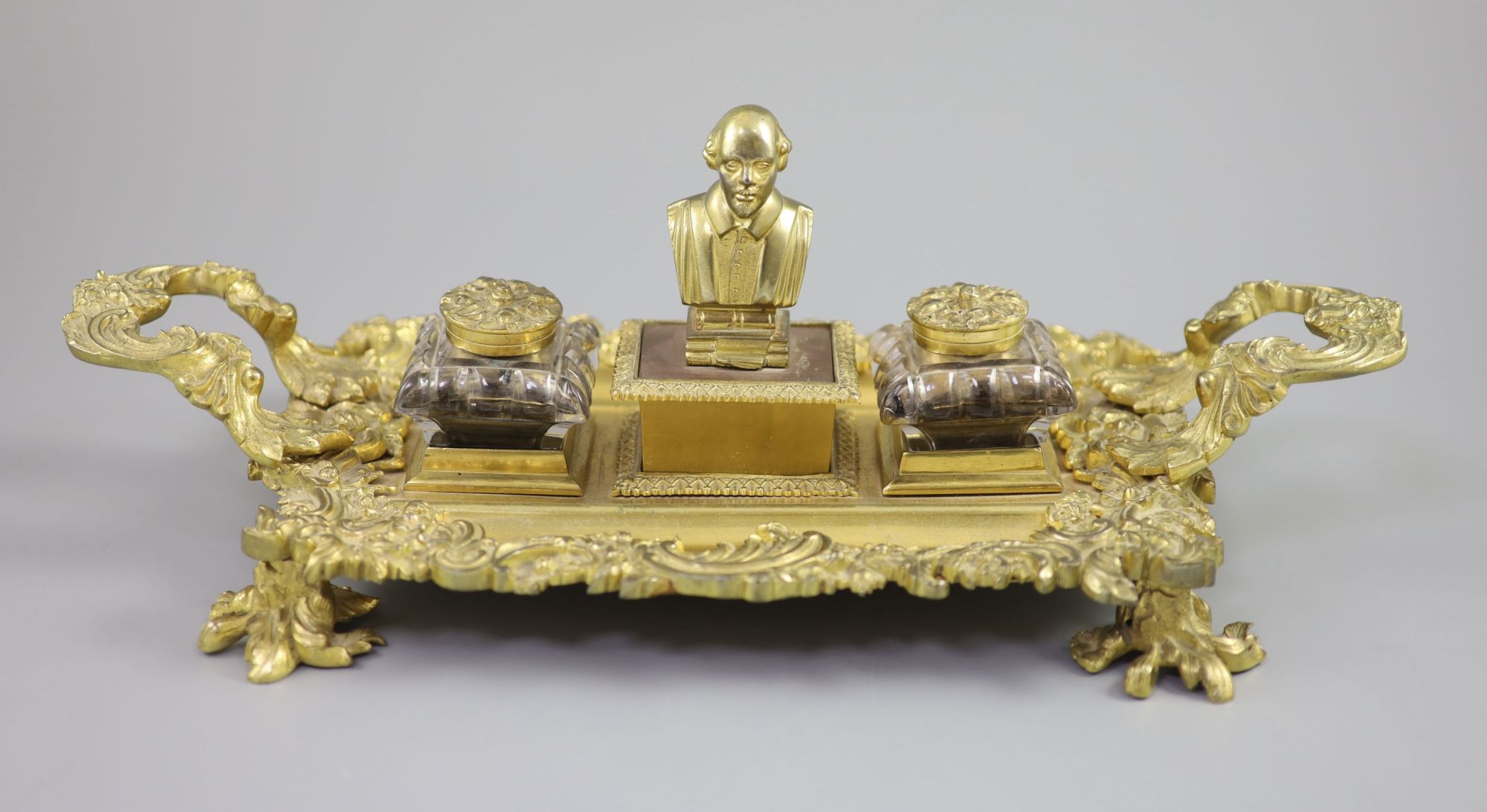 A Victorian ormolu ink stand, width 17.5in. depth 9in. height 6in.